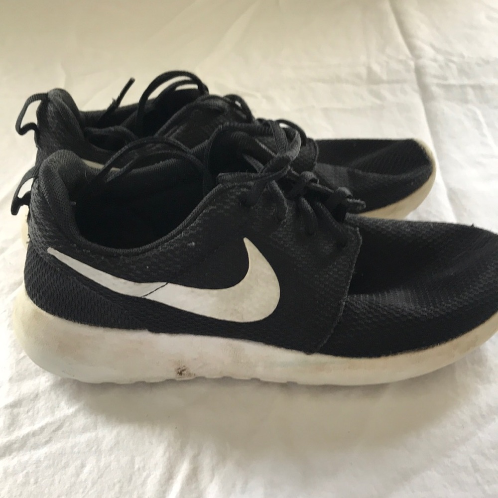 Nike black and silver roshes